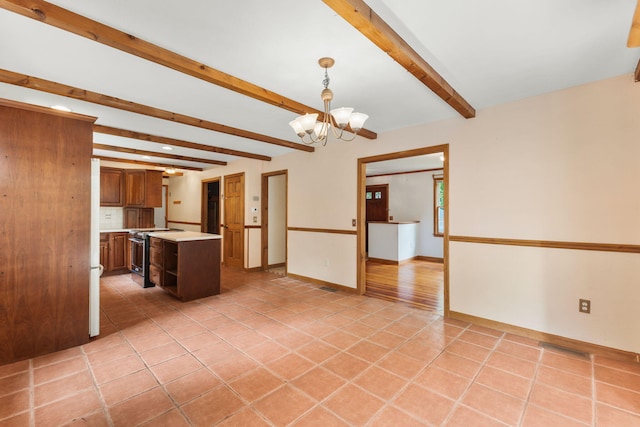 29 Windward Walk, Harwich Port, MA 02646 - kitchen featuring electric range, light countertops, beam ceiling, a chandelier, and light tile patterned floors