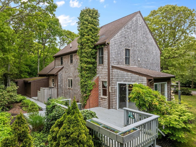 29 Windward Walk, Harwich Port, MA 02646 - rear view of house with a shingled roof and a deck