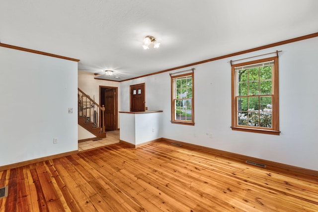 29 Windward Walk, Harwich Port, MA 02646 - empty room featuring light wood-style flooring, ornamental molding, stairway, and baseboards