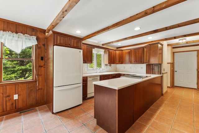 29 Windward Walk, Harwich Port, MA 02646 - kitchen with white appliances, beam ceiling, light countertops, decorative backsplash, and light tile patterned floors