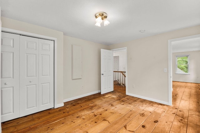 29 Windward Walk, Harwich Port, MA 02646 - unfurnished bedroom featuring light wood-style flooring, baseboards, and a closet
