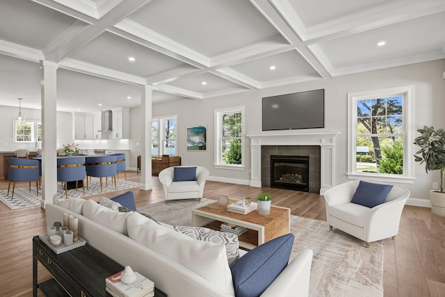 14 Azalea Ln, Mashpee, MA 02649 - living area featuring coffered ceiling, healthy amount of natural light, ornate columns, light wood-type flooring, and beam ceiling