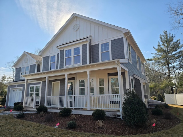 view of front of property featuring a garage and covered porch