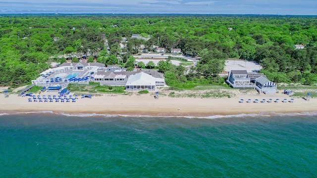 bird's eye view with a water view and a beach view