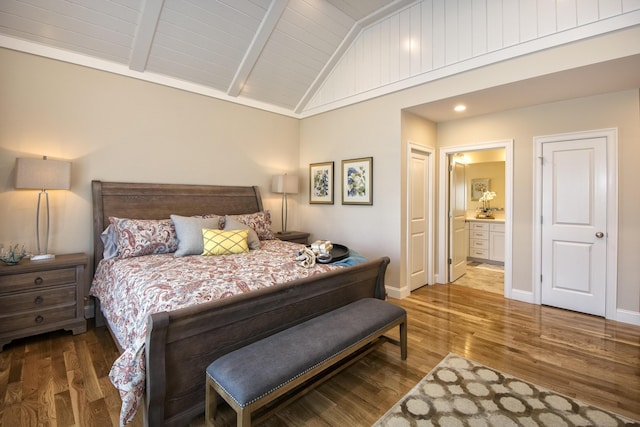 bedroom featuring wood ceiling, vaulted ceiling with beams, ensuite bath, and dark hardwood / wood-style flooring