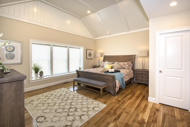 bedroom featuring dark wood-type flooring and lofted ceiling