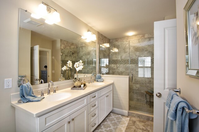 bathroom with vanity and an enclosed shower