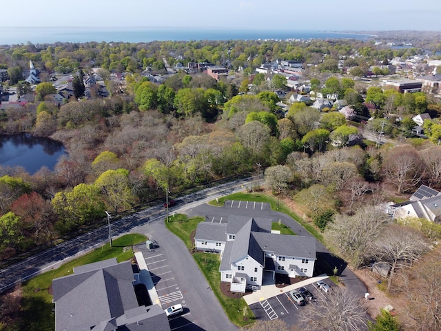 drone / aerial view featuring a water view and a residential view