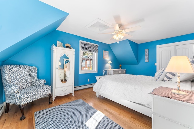 7 John St, Wareham, MA 02571 - bedroom with a closet, a baseboard radiator, wood finished floors, a ceiling fan, and vaulted ceiling