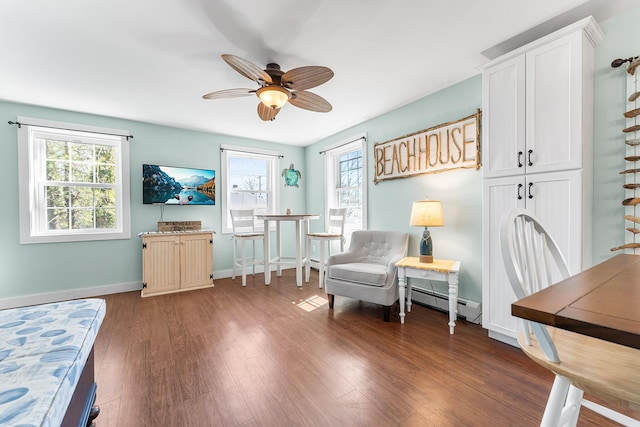 7 John St, Wareham, MA 02571 - living area featuring baseboards, wood finished floors, a baseboard heating unit, and a ceiling fan