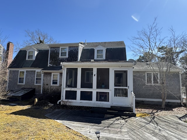 34 Charles Rd, Harwich, MA 02645 - rear view of house with a sunroom, a chimney, and a shingled roof