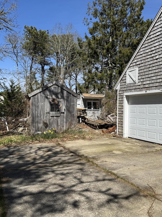 34 Charles Rd, Harwich, MA 02645 - view of property exterior with driveway and a garage