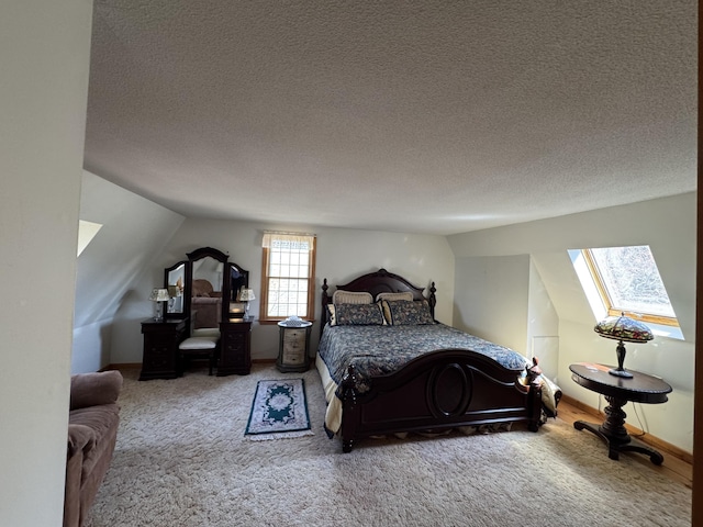 34 Charles Rd, Harwich, MA 02645 - carpeted bedroom featuring a skylight, a textured ceiling, and lofted ceiling