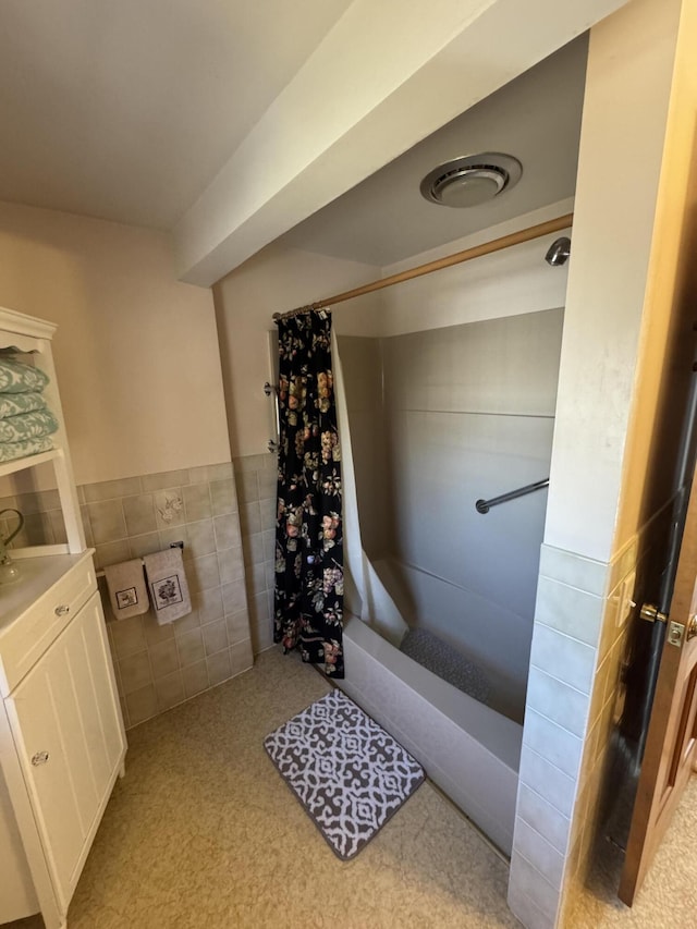 34 Charles Rd, Harwich, MA 02645 - full bathroom featuring vanity, tile walls, and wainscoting