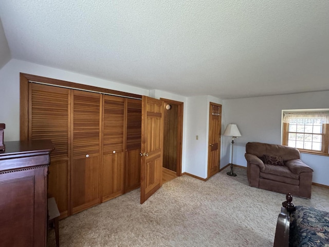 34 Charles Rd, Harwich, MA 02645 - bedroom featuring a textured ceiling, a closet, and light carpet