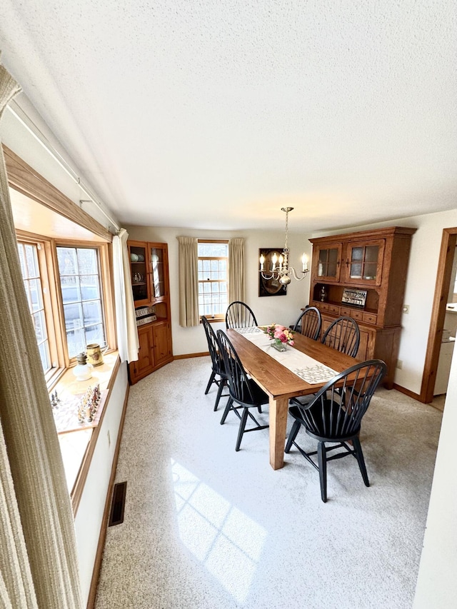 34 Charles Rd, Harwich, MA 02645 - dining room featuring a chandelier, baseboards, and a textured ceiling