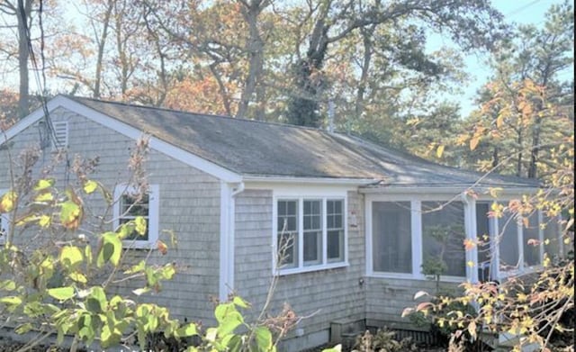 view of home's exterior featuring a sunroom