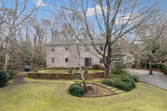 29 Sturgis Ln, Barnstable, MA 02630 - view of green lawn with central air condition unit and asphalt driveway