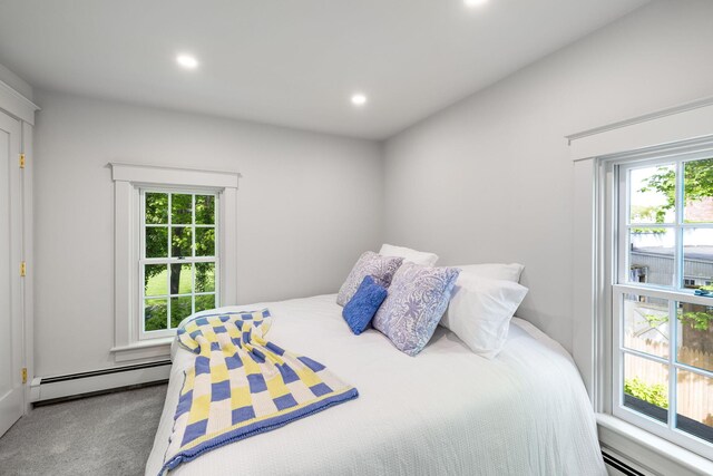 1180 Main St, Cotuit, MA 02635 - carpeted bedroom featuring a baseboard heating unit, multiple windows, baseboard heating, and recessed lighting