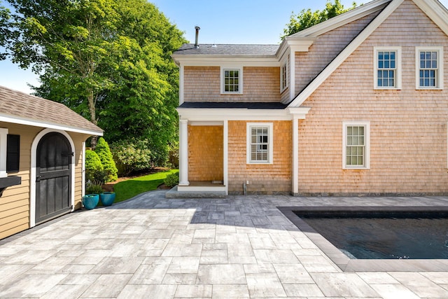 1180 Main St, Cotuit, MA 02635 - back of house with a patio and a shingled roof