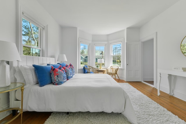 bedroom with wood-type flooring