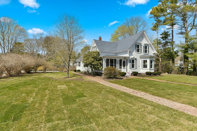 view of property exterior with a yard, a shingled roof, and a chimney