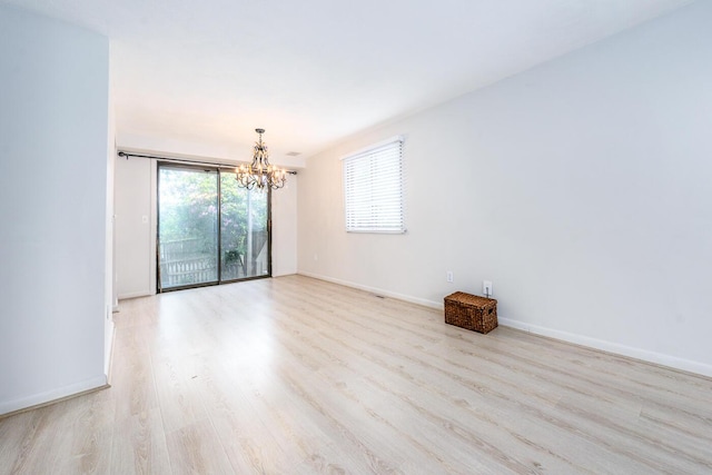 329 W Main St Unit 30, Hyannis, MA 02601 - unfurnished room with a chandelier and wood finished floors