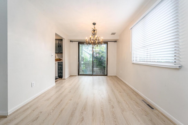 329 W Main St Unit 30, Hyannis, MA 02601 - unfurnished dining area with a chandelier and light wood-style floors