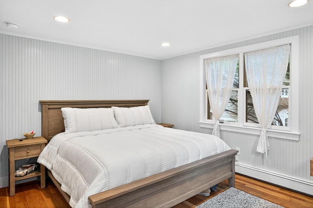 908 W Falmouth Hwy, Falmouth, MA 02540 - bedroom featuring a baseboard radiator, wood finished floors, and recessed lighting