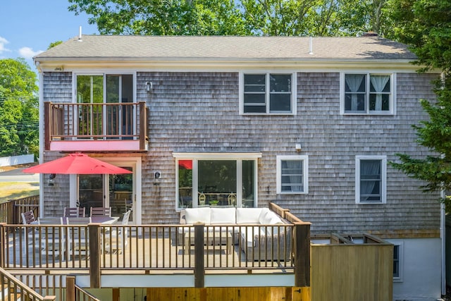 908 W Falmouth Hwy, Falmouth, MA 02540 - rear view of house featuring an outdoor hangout area, a balcony, roof with shingles, and outdoor dining space