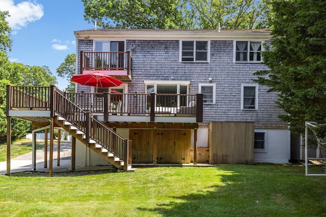 908 W Falmouth Hwy, Falmouth, MA 02540 - rear view of house with stairway, a lawn, a balcony, and a deck