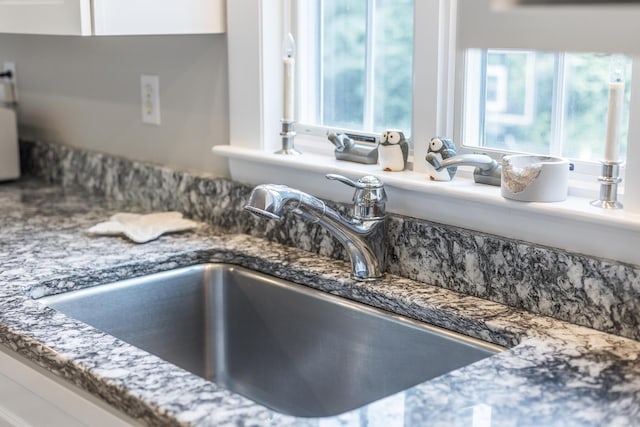 908 W Falmouth Hwy, Falmouth, MA 02540 - detailed view of stone counters and white cabinets