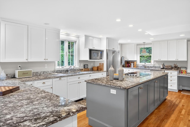 908 W Falmouth Hwy, Falmouth, MA 02540 - kitchen with appliances with stainless steel finishes, white cabinets, gray cabinets, light wood-type flooring, and recessed lighting