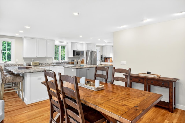 908 W Falmouth Hwy, Falmouth, MA 02540 - dining room featuring light wood-style floors and recessed lighting