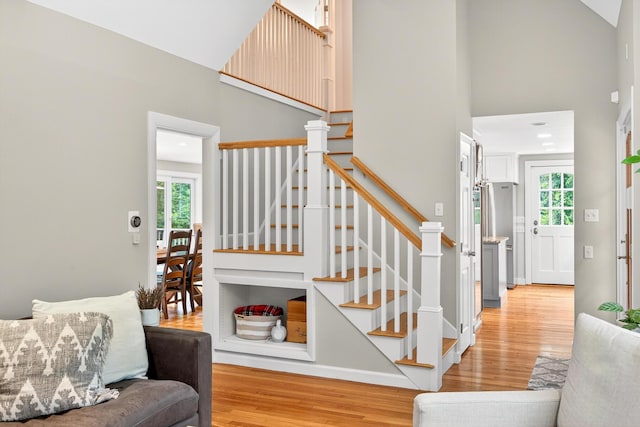 908 W Falmouth Hwy, Falmouth, MA 02540 - stairs with wood finished floors, plenty of natural light, and a high ceiling