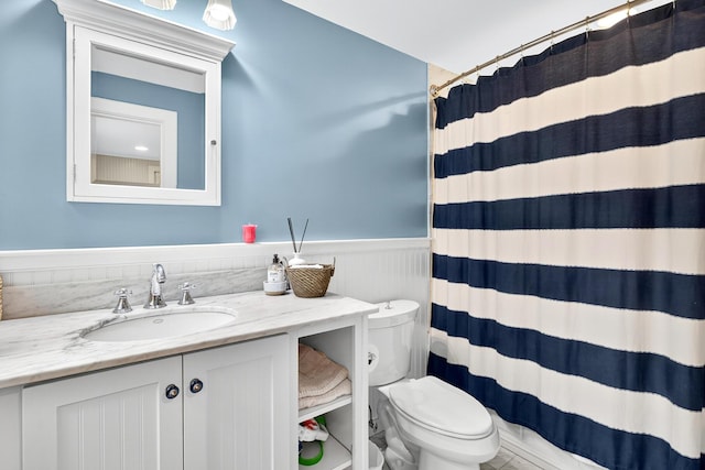 908 W Falmouth Hwy, Falmouth, MA 02540 - full bathroom featuring wainscoting, vanity, and a shower with shower curtain