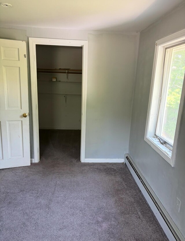 62 Musket Ln, Mashpee, MA 02649 - unfurnished bedroom with a baseboard heating unit, carpet flooring, multiple windows, and a closet
