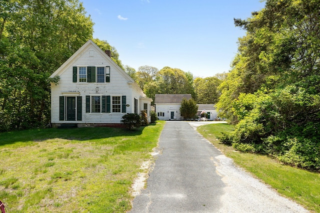 1424 Main St, Brewster, MA 02631 - view of front of home with a front yard and driveway