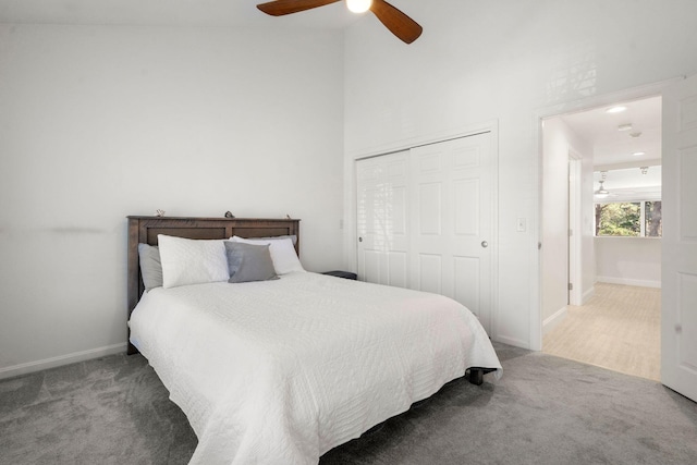 bedroom with carpet flooring, a closet, a ceiling fan, and baseboards