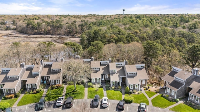aerial view of residential area with a heavily wooded area