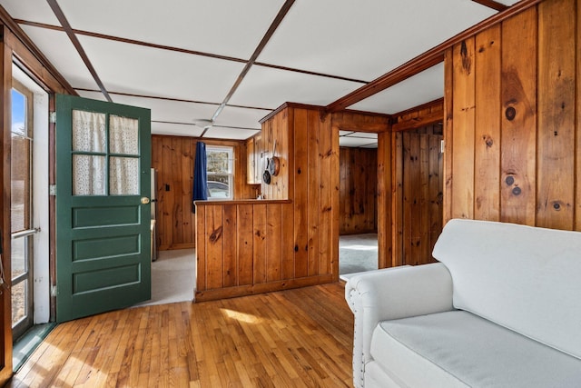 interior space with wood walls and light wood finished floors