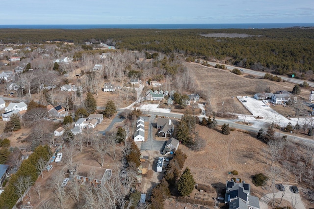 drone / aerial view featuring a forest view