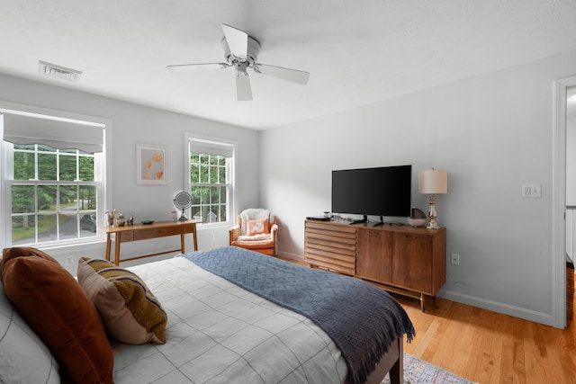95 Red Brook Rd, Waquoit, MA 02536 - bedroom featuring multiple windows, light wood-style floors, and a ceiling fan