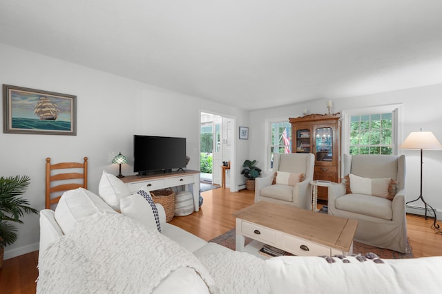95 Red Brook Rd, Waquoit, MA 02536 - living area featuring a baseboard radiator and wood finished floors