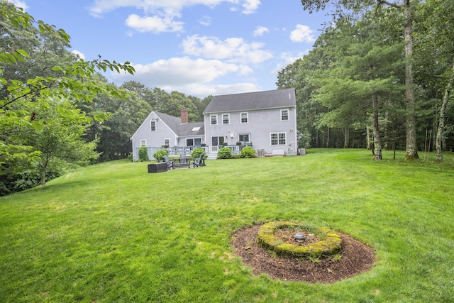 95 Red Brook Rd, Waquoit, MA 02536 - rear view of house with a yard and a chimney