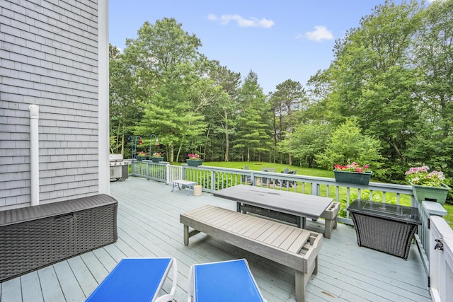 95 Red Brook Rd, Waquoit, MA 02536 - wooden deck with outdoor dining area and view of wooded area