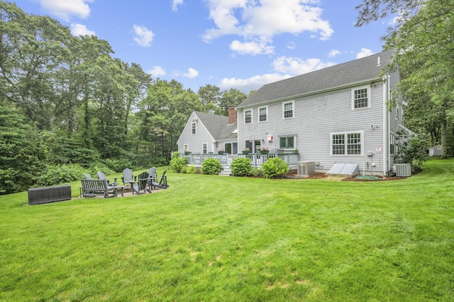 95 Red Brook Rd, Waquoit, MA 02536 - back of property with a yard, a fire pit, a wooden deck, and a chimney