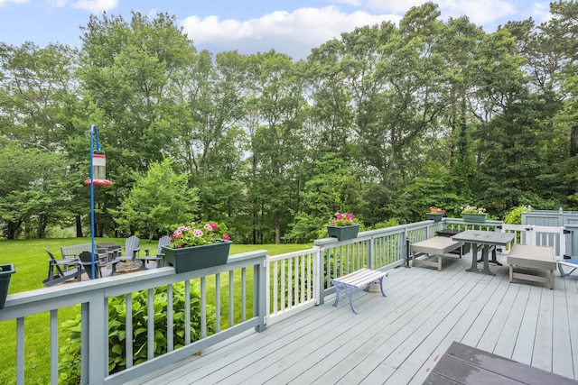 95 Red Brook Rd, Waquoit, MA 02536 - wooden deck featuring outdoor dining space, a lawn, and view of wooded area