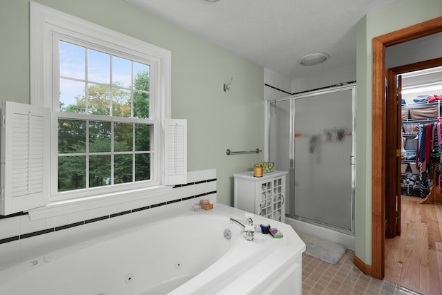 95 Red Brook Rd, Waquoit, MA 02536 - bathroom with a stall shower, a jetted tub, and a textured ceiling