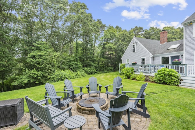 95 Red Brook Rd, Waquoit, MA 02536 - view of grassy yard with an outdoor fire pit and a deck